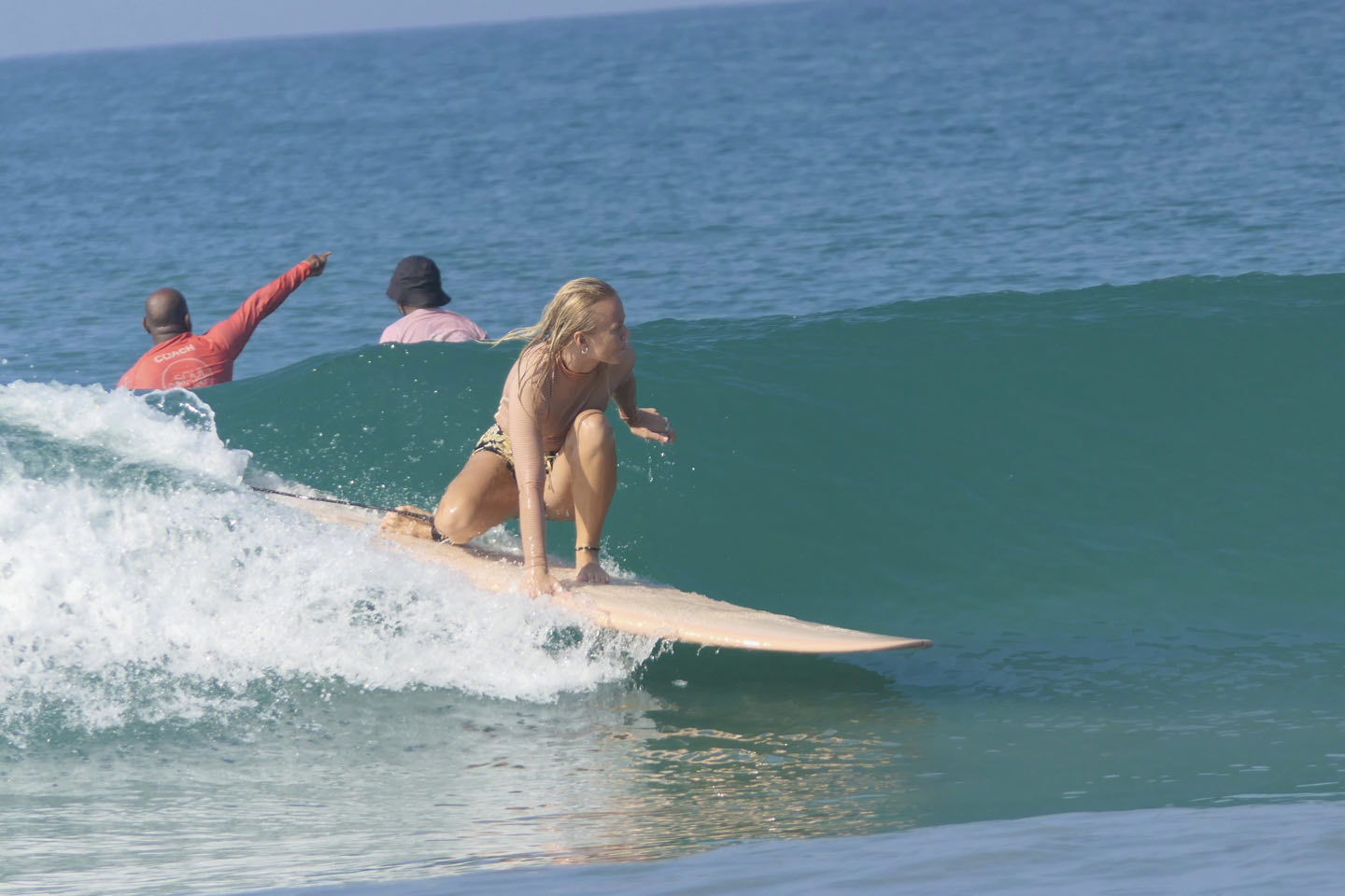 Surfer catching a small wave